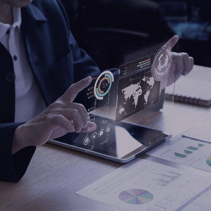 Business man or analyst expanding futuristic investment virtual screen over a modern tablet. Showing if charts and infographic for investment analysis.